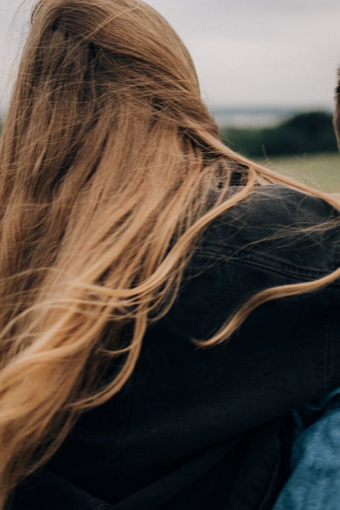 pexels-photo-9961408-9961408 A couple embracing while enjoying a peaceful moment outdoors with nature as their backdrop.